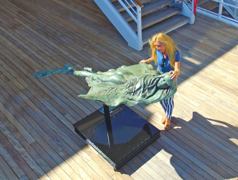 L'Ange Des Mers with sculptor Amaryllis at the Yacht Club of Monaco.  Photo © Philip Jepsen.