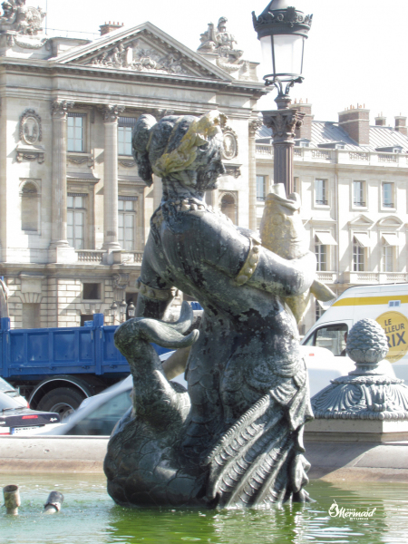 Mermaid in the fountain  at Place de la Concorde.  Photo © by Mica Moore.