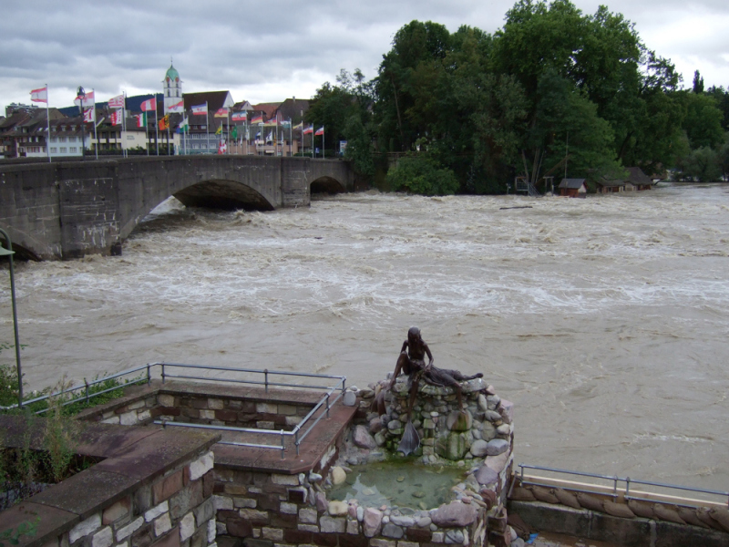 Rheinfelden Mermaid Statue, in flood water conditions.  Photo by Patrick Scherrer