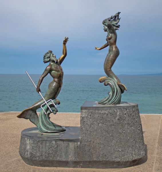 Statue of Triton and a mermaid on the coast of Puerto Vallarta.  Photo © by Morenaki 123RF